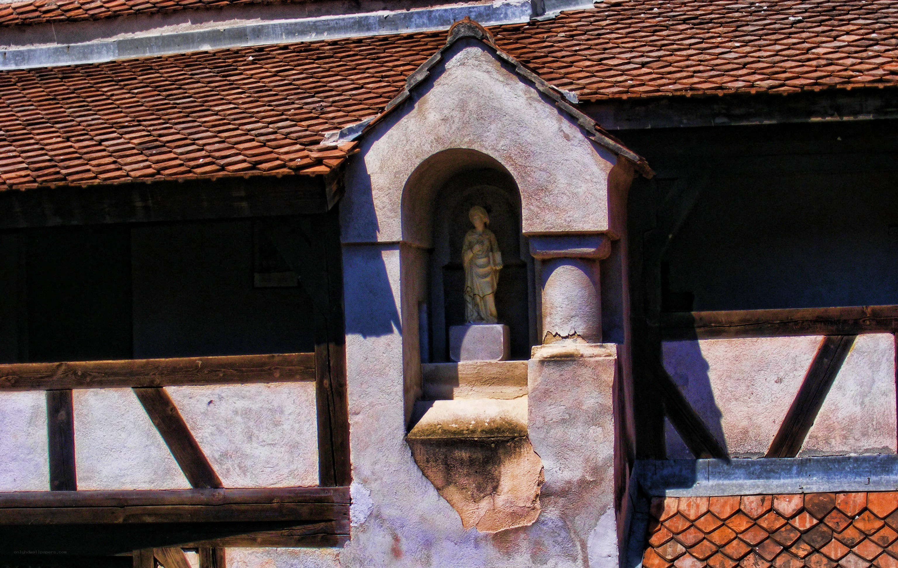 statue in a niche on a building
