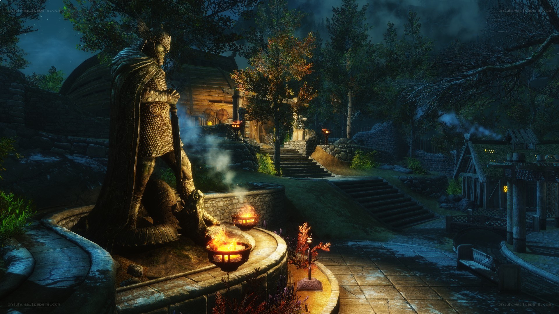 statue in a village at night