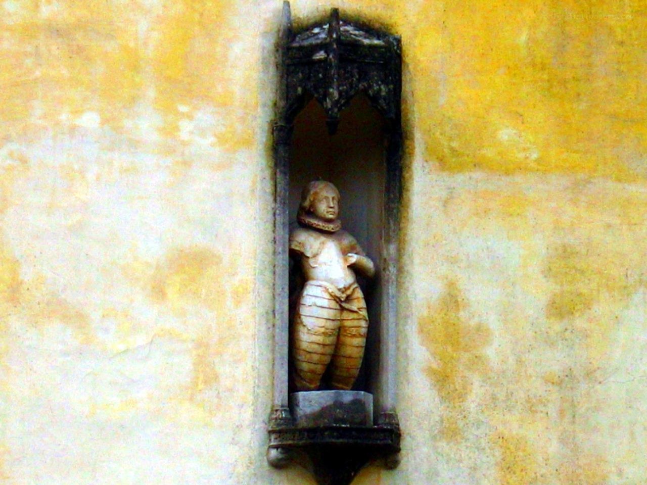 statue in a wall niche