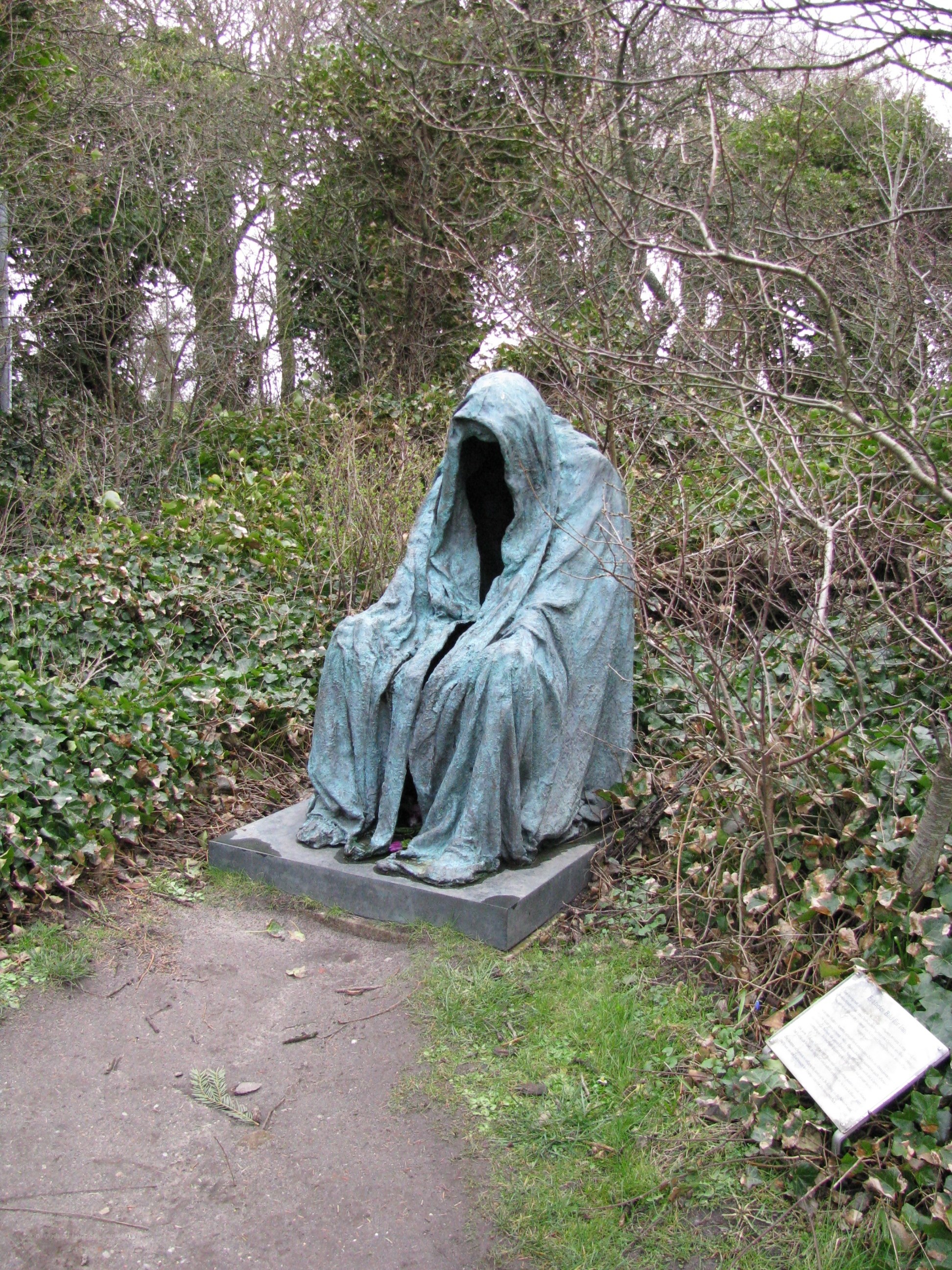 Statue in a wooded area