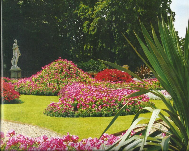 Statue in Flower Garden — Green, Serene