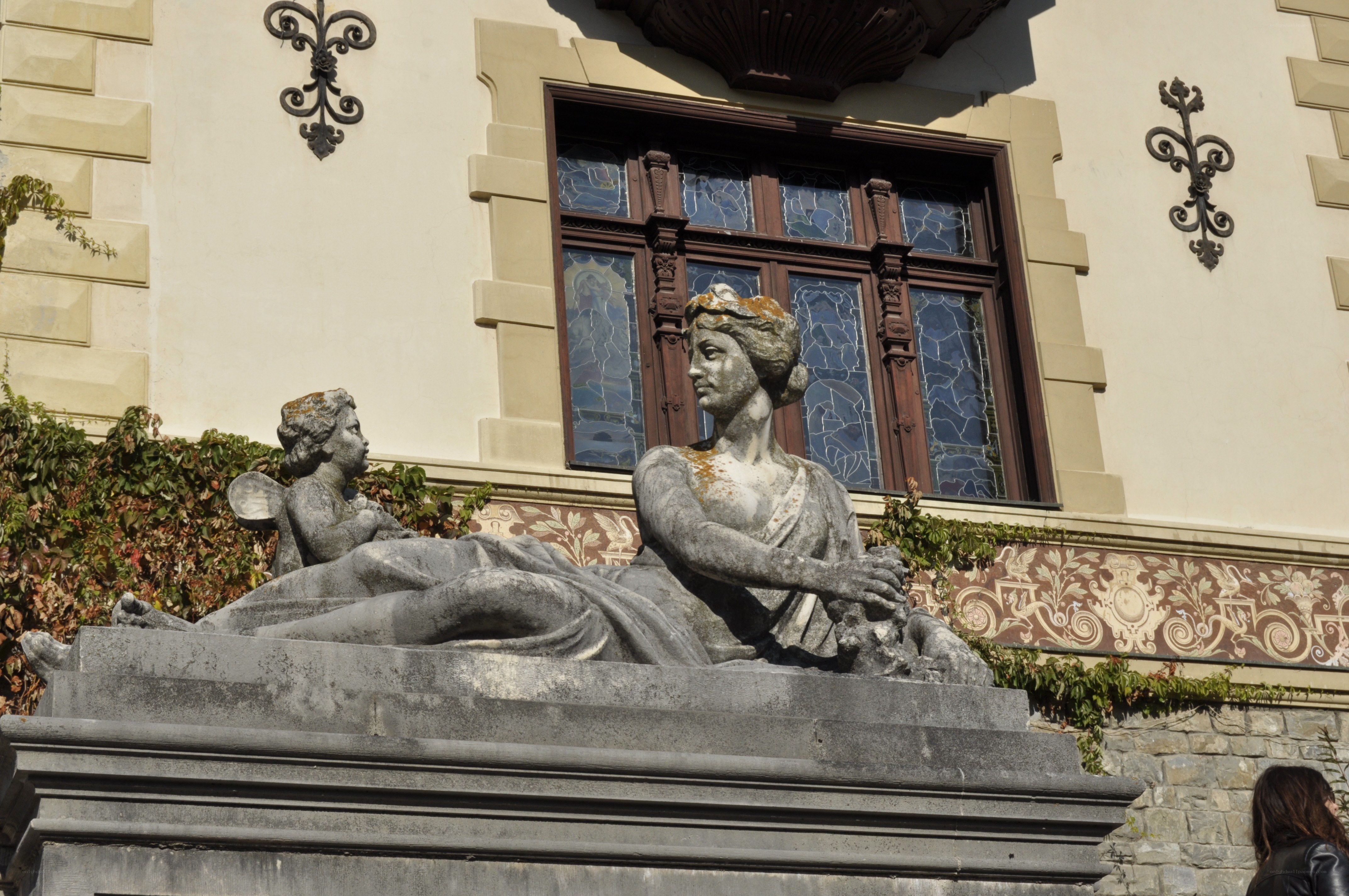 Statue in front of building
