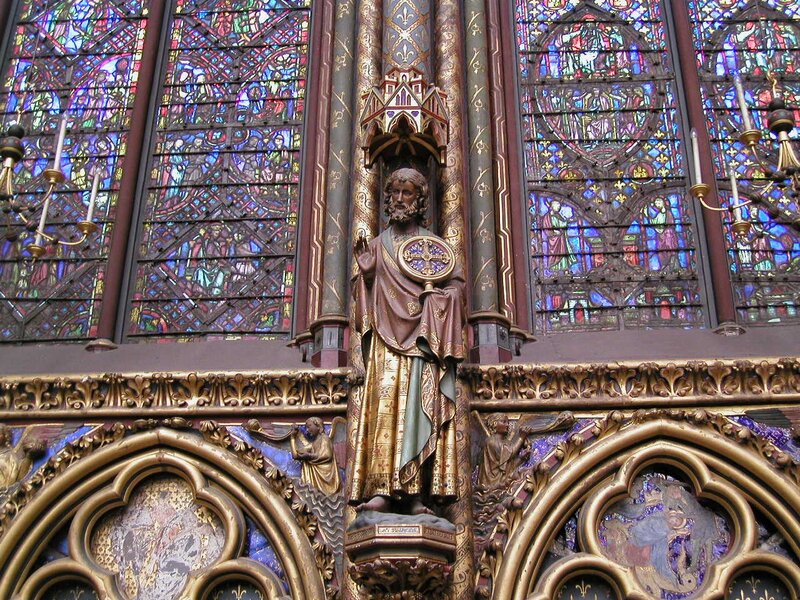 statue in stained glass church