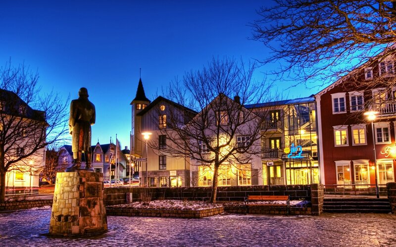 statue in town square at dusk