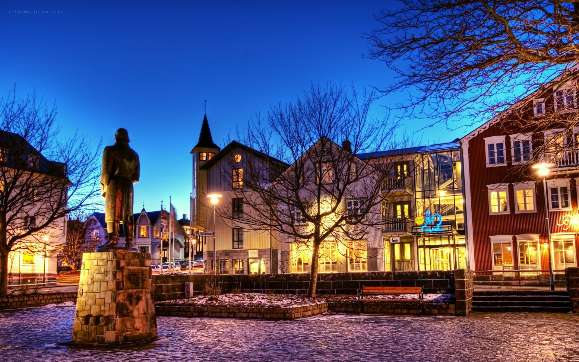 statue in town square at dusk