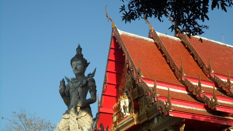 Statue Near Temple Roof