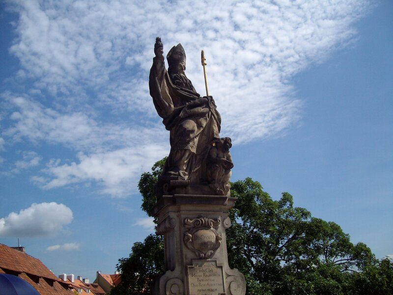 statue of a bishop on a pedestal