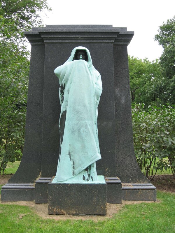 Statue of a cloaked figure