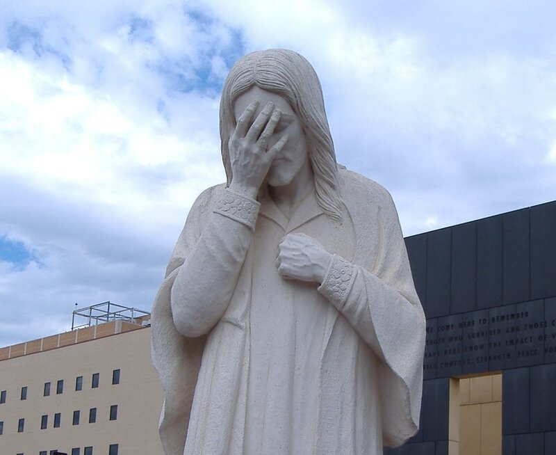 statue of a grieving figure