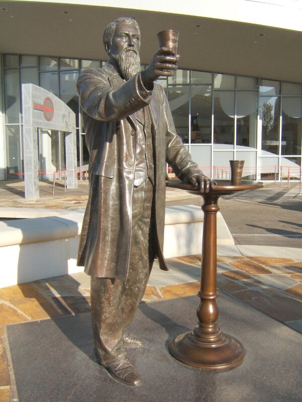 statue of a man with a cup