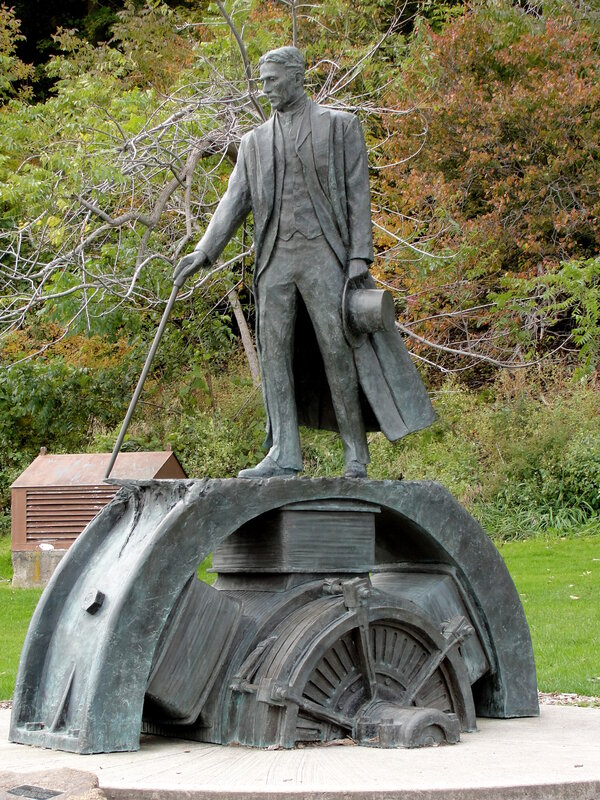 statue of a man with walking stick