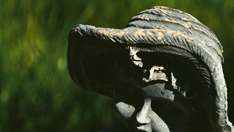 statue of a person in a hat