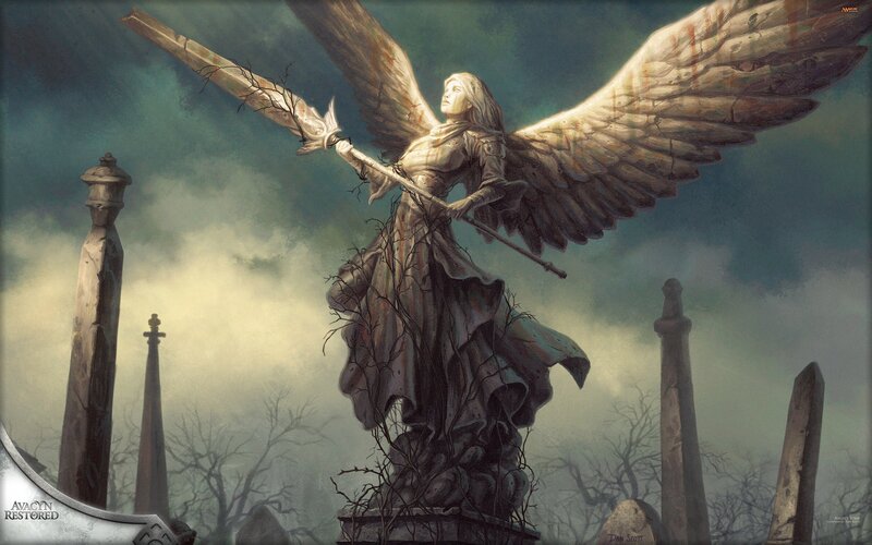Statue of a winged angel in a graveyard