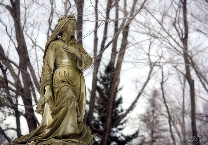 Statue of a woman in a garden