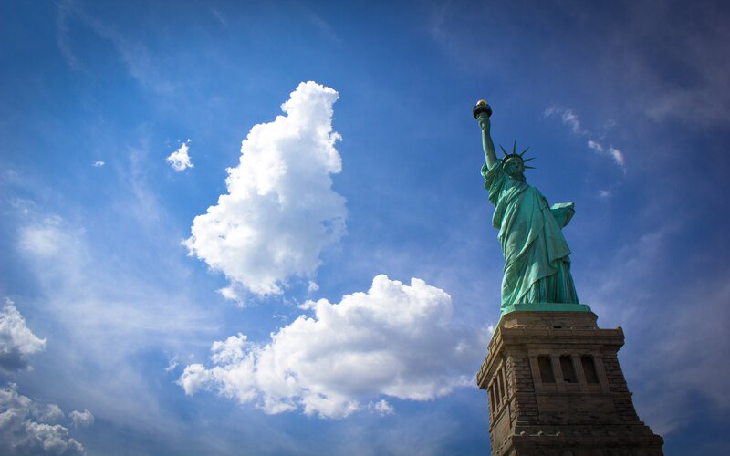 Statue of Liberty against blue sky