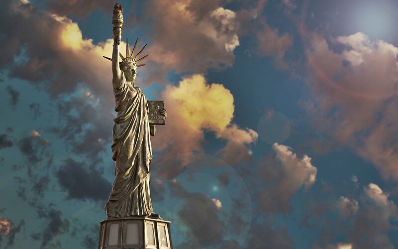 Statue of Liberty against cloudy sky