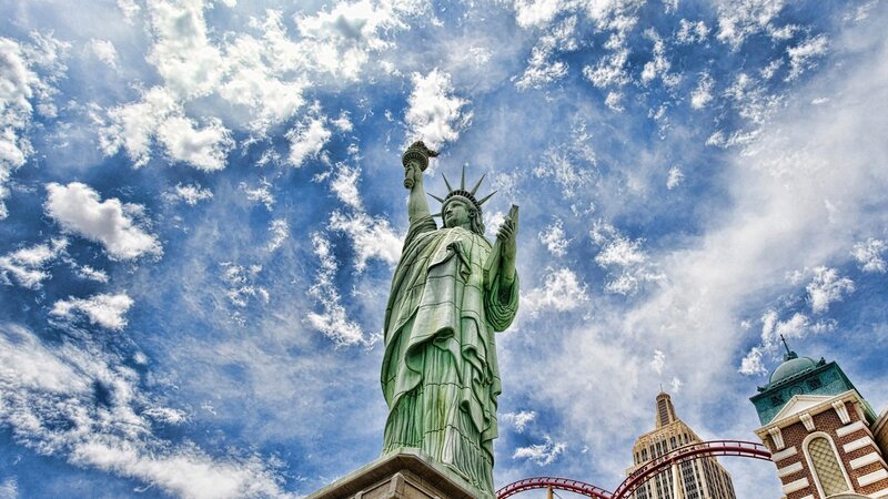 Statue of Liberty Replica — Blue, Dramatic, Afternoon, Photograph, Roller Coaster, Buildings