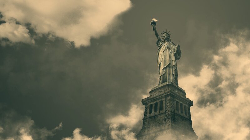 Statue of Liberty under cloudy sky