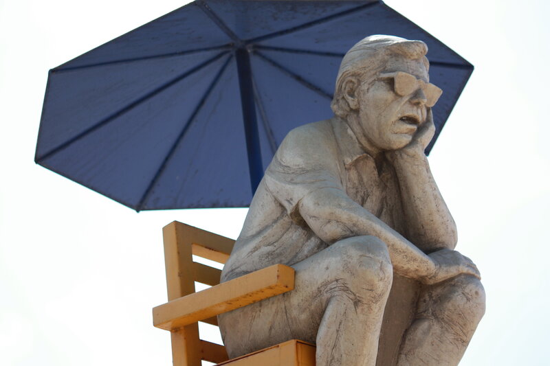 Statue of Man on Chair