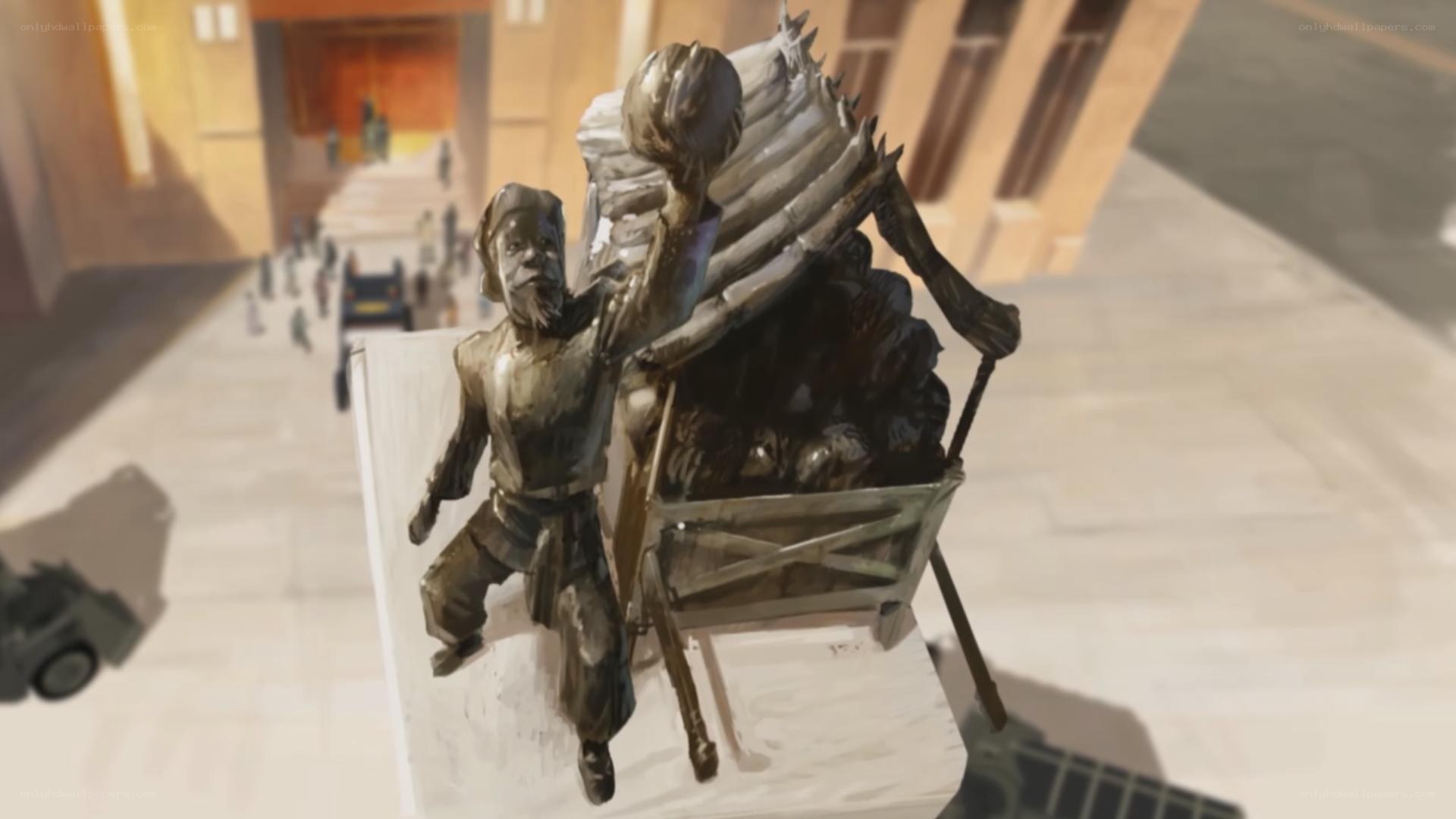 statue of man with cart