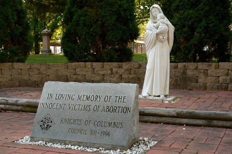 Statue of Mary Holding Child — Gray