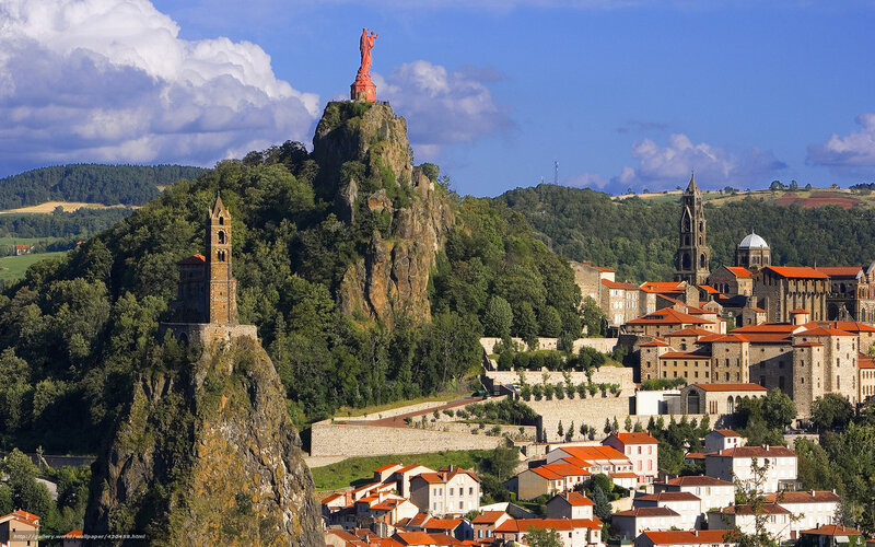 Statue of Mary overlooking a town