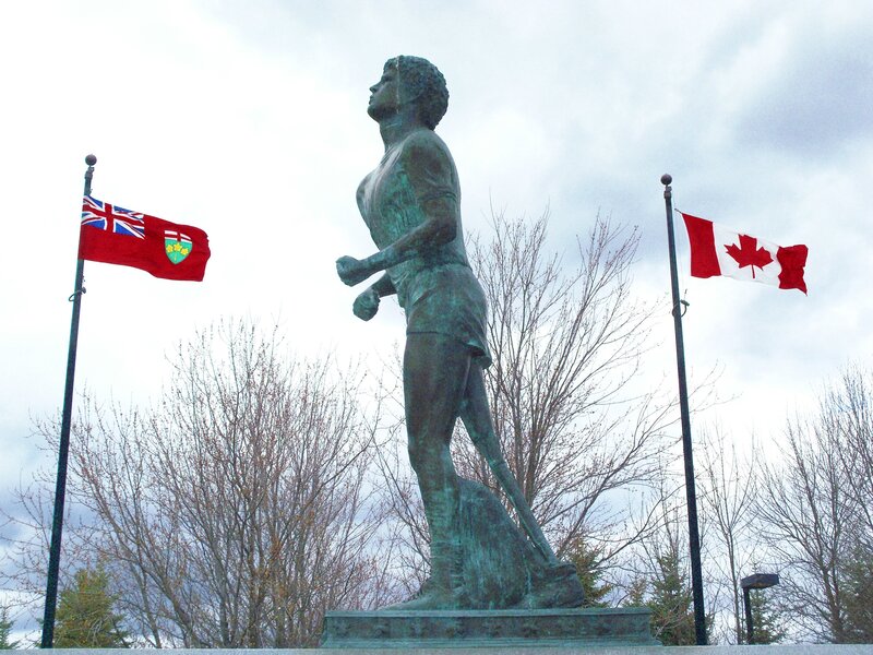 statue of runner with flags