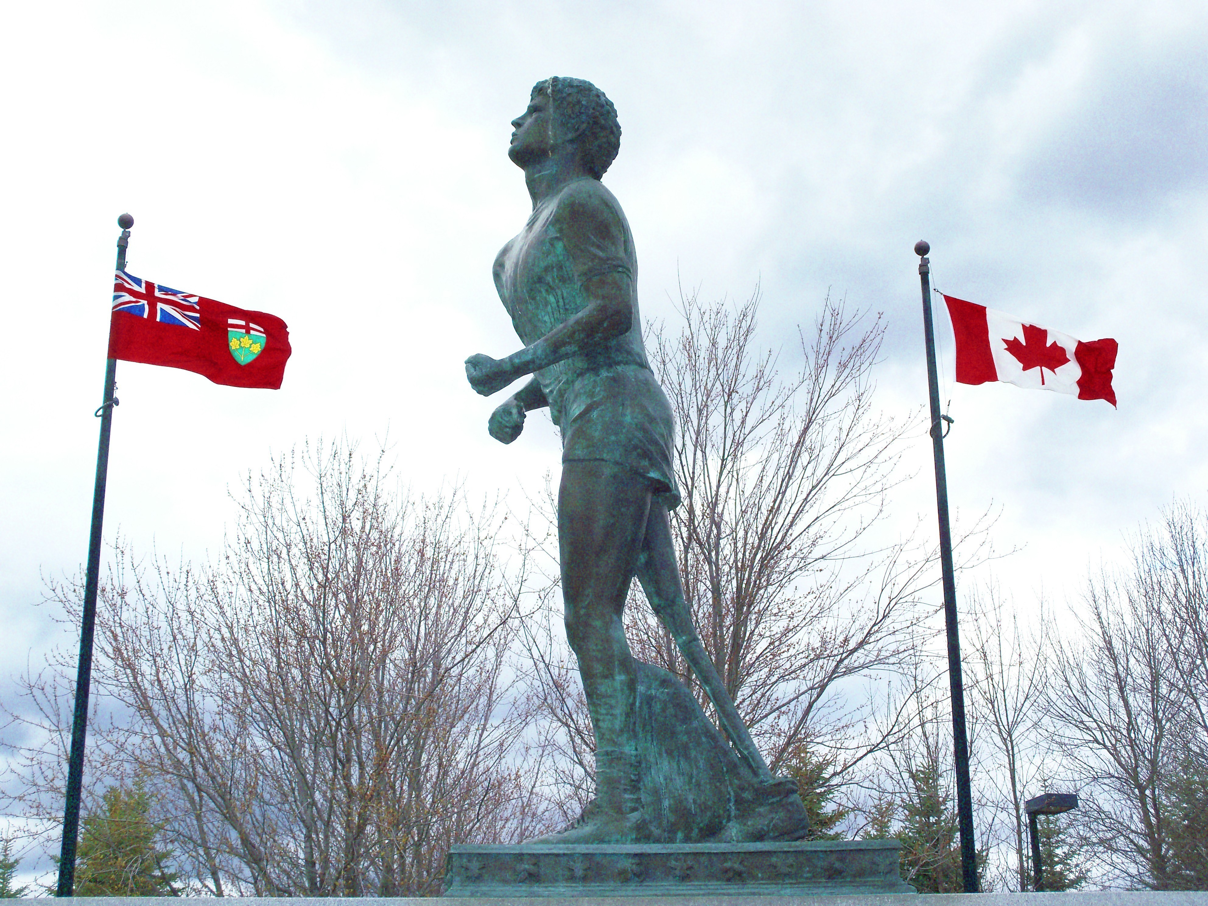 statue of runner with flags