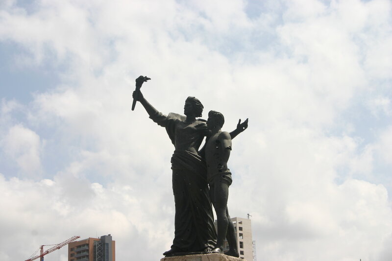 Statue of two figures with torch
