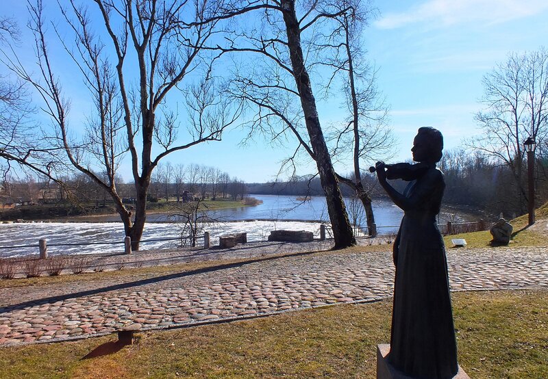Statue of Woman Playing Violin