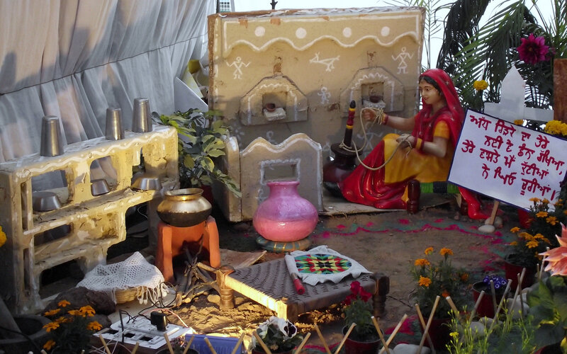 Statue of Woman Weaving