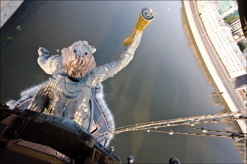 Statue on a bridge over river