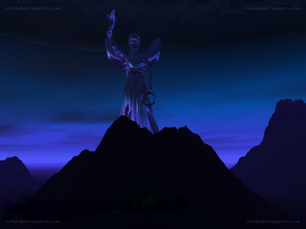 statue on a mountain at night