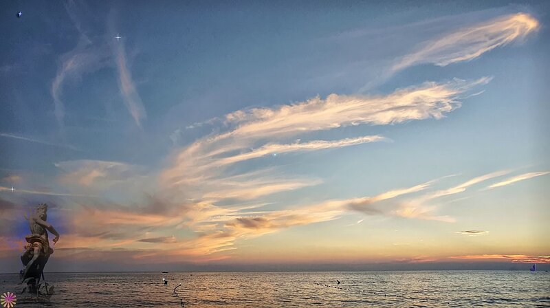 Statue on Beach at Sunset