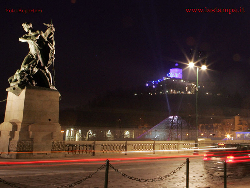 Statue on Bridge at Night
