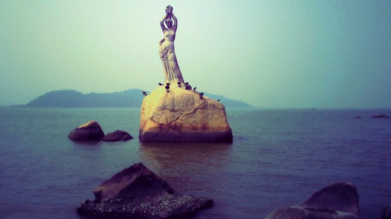 Statue on Rock in Sea