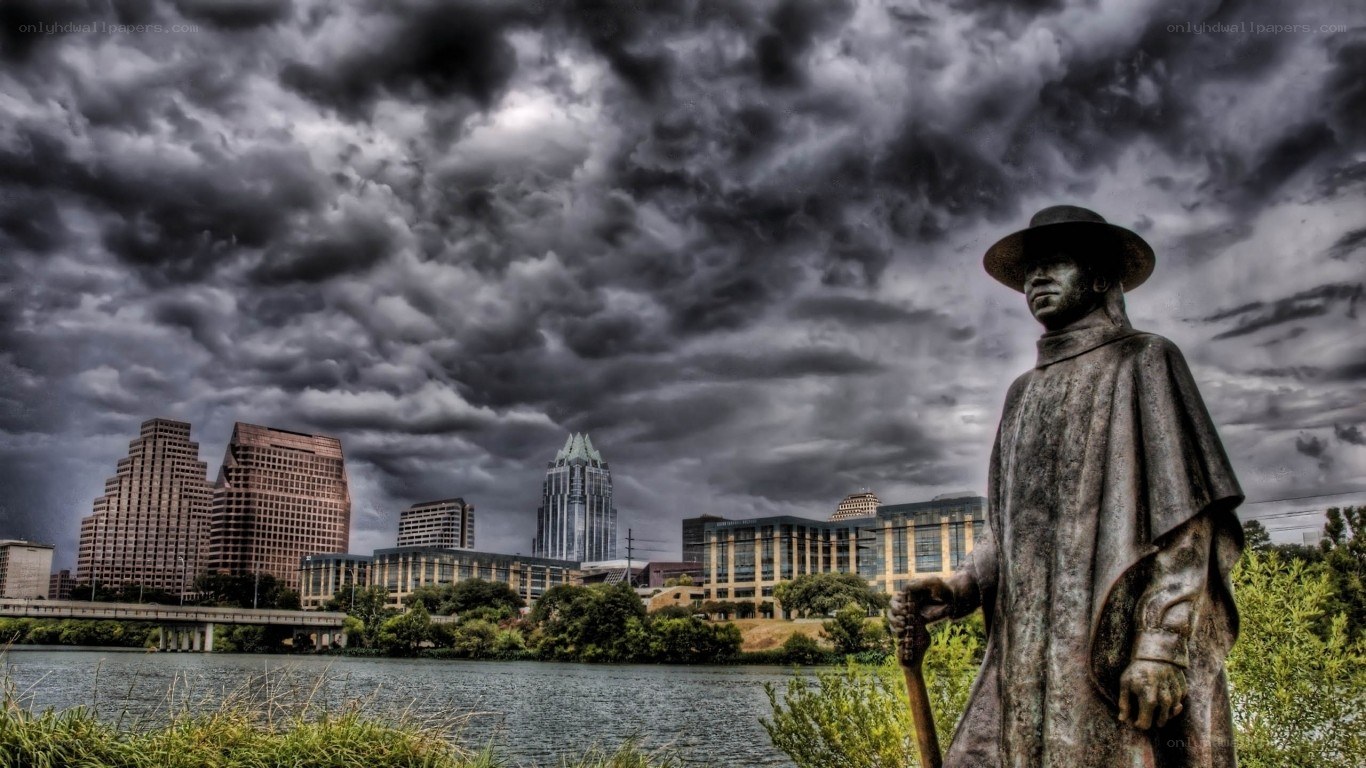 Statue overlooking city skyline