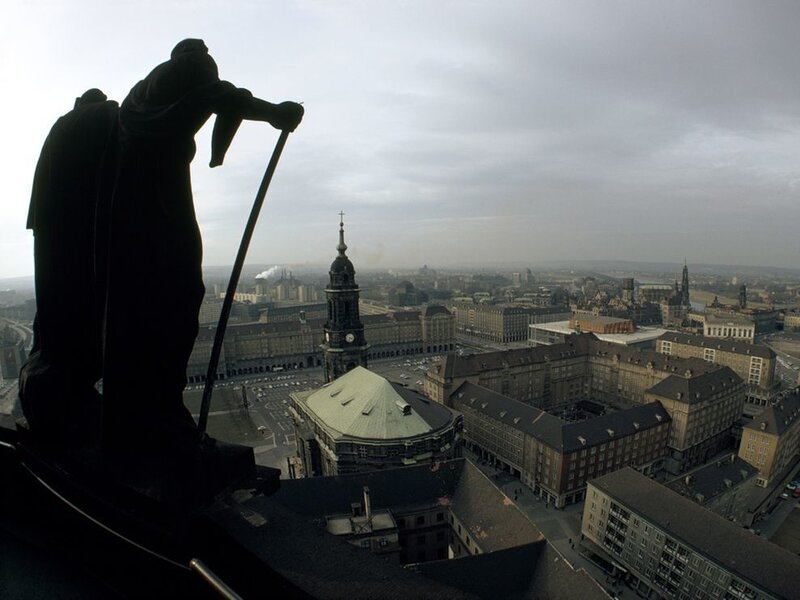 Statue overlooking cityscape