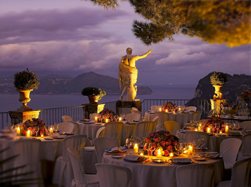 Statue Overlooking Dinner Tables
