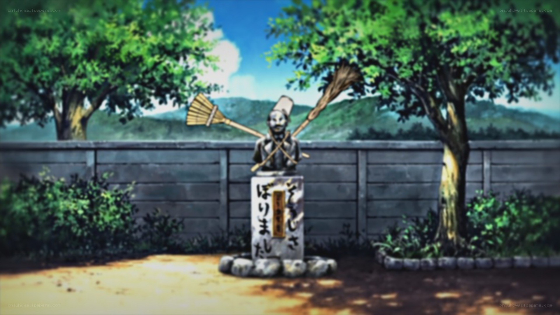 statue with brooms in garden