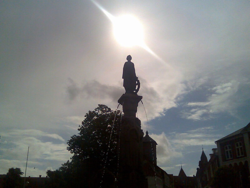 statue with fountain in sunlight