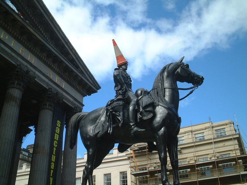 Statue with traffic cone