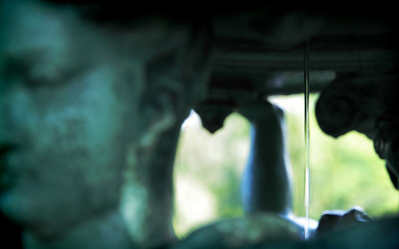statue with water droplet