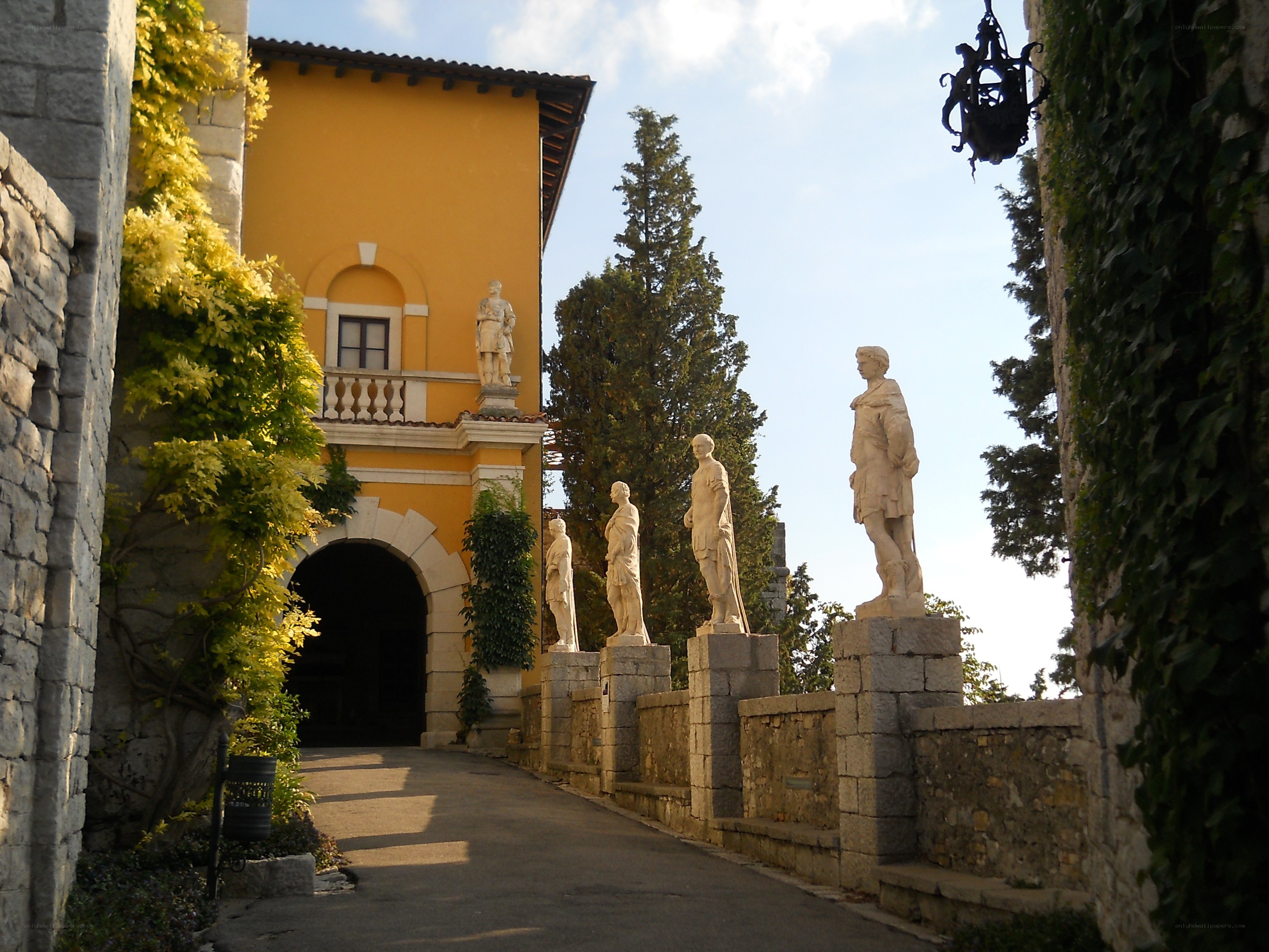 statues along a stone pathway