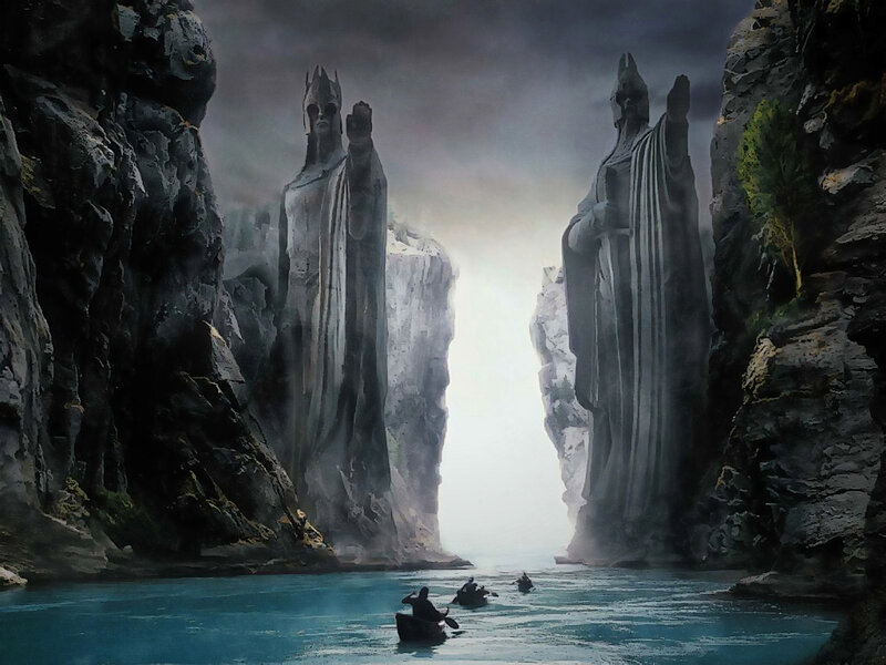 Statues flanking a river passage