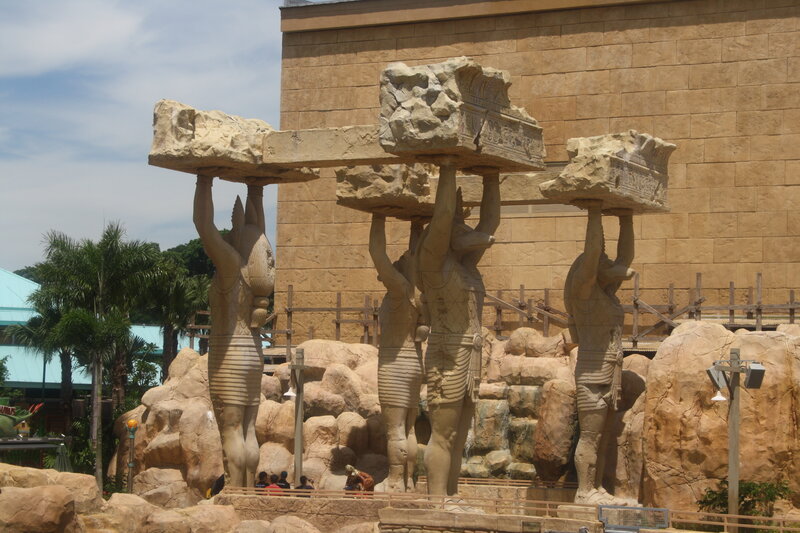 Statues Holding Stone Blocks
