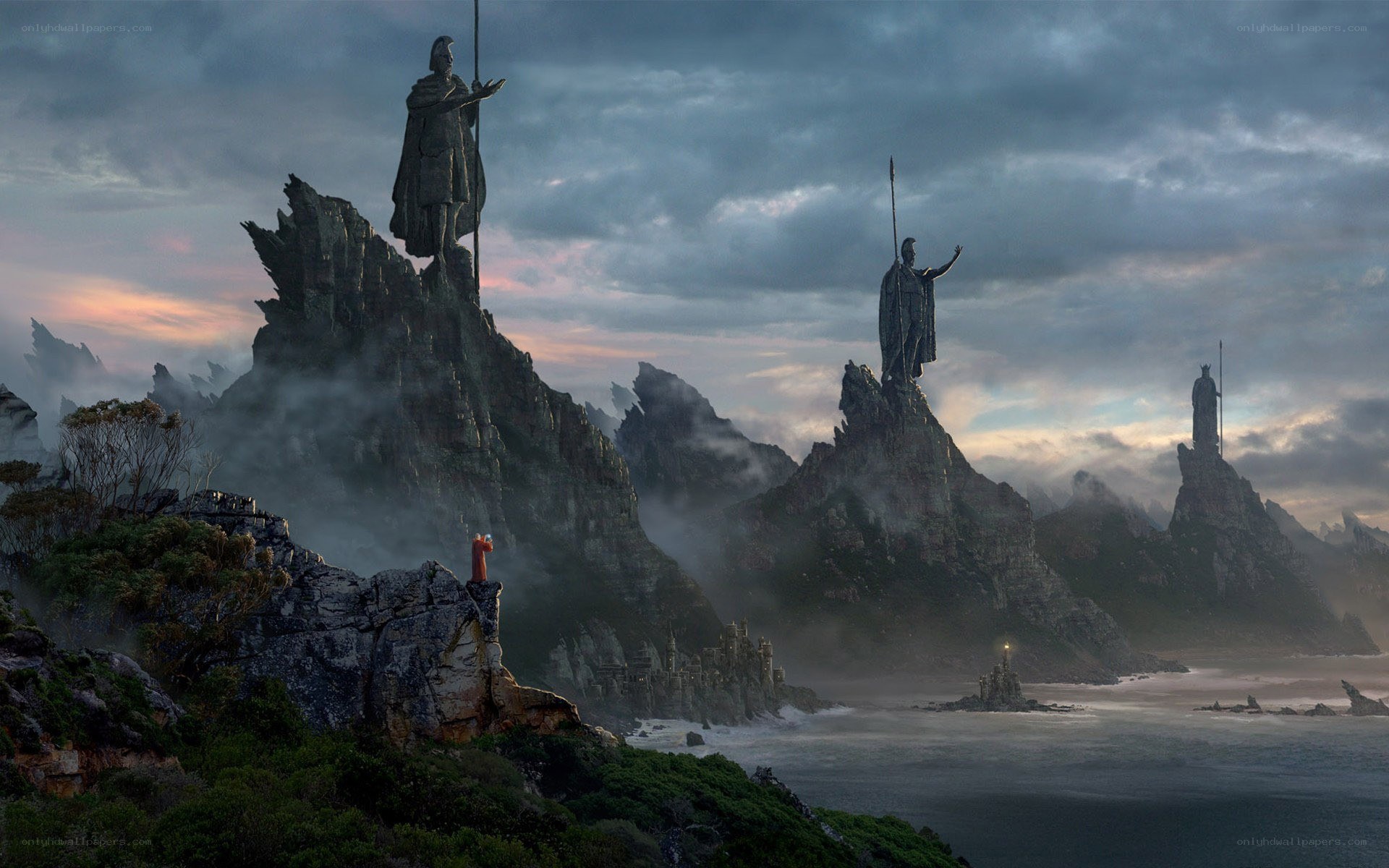 Statues on a misty coast