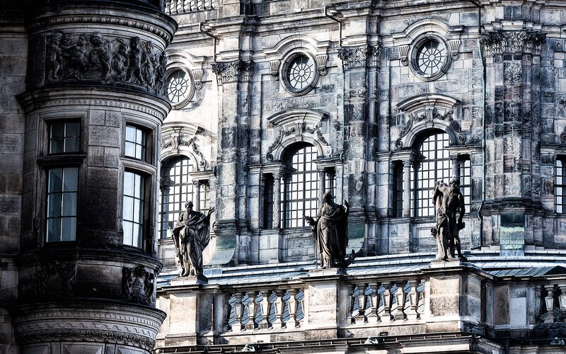 Statues on Building Facade — Gray
