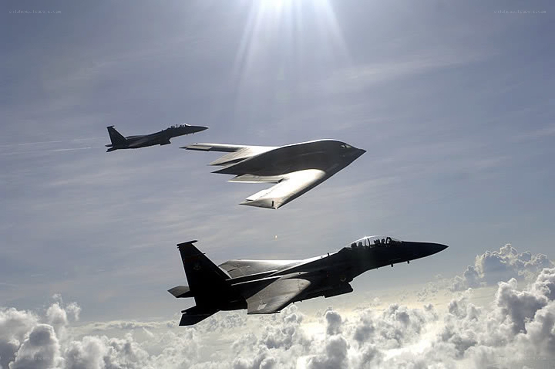 Stealth bomber with fighter escorts