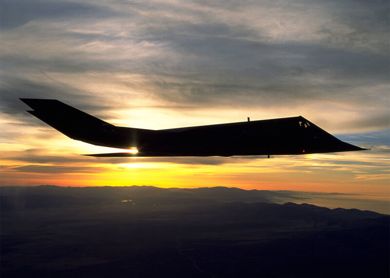 Stealth fighter at sunset